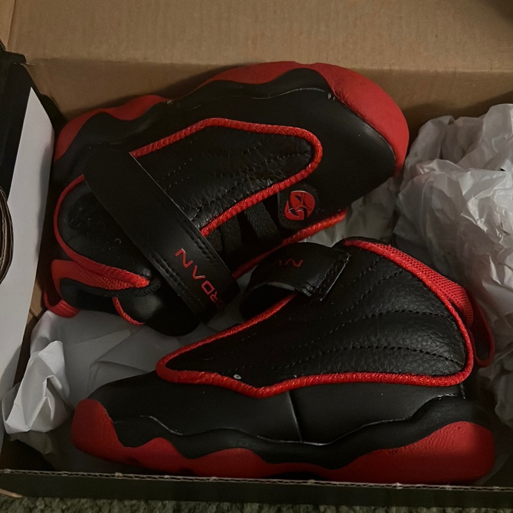 Black & red toddler Jordans. Worn once